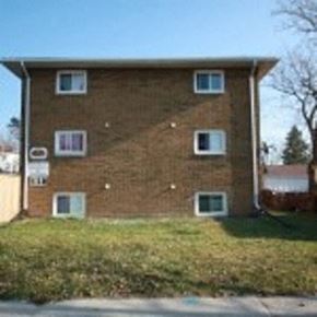 Sarnia apartment for rent - a brick house with windows on the side of it