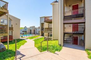Nashville apartment for rent - Apartment complex with a pool and a walkway.
