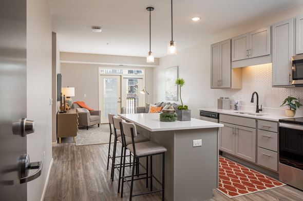 Burnsville apartment for rent - A modern kitchen with a dining table and chairs.
