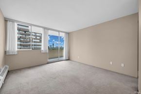 New Westminster apartment for rent - A room with a window overlooking a cityscape.