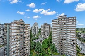 New Westminster apartment for rent - A view of a residential area with multiple apartment buildings and a clear blue sky.