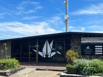 Kailua Kona apartment for rent - a building with a sign on the front of it