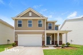 Charlotte house for rent - a tan house with a white garage door