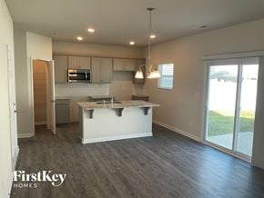 Charlotte house for rent - an empty kitchen with an island in the middle of it