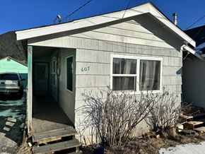 Sitka house for rent - A small house with the number 607 on the front door.
