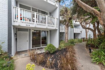 Redondo Beach apartment for rent - the front of a house with a white door and a balcony