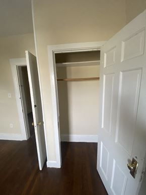 Bridgeport apartment for rent - the closet in the master bedroom is empty and the door is open to the hallway