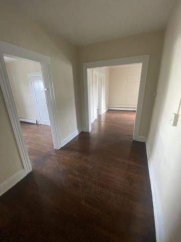 Bridgeport apartment for rent - a view from the living room into the dining room and the hallway with wood floors