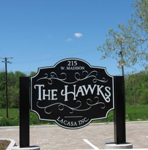 Goshen apartment for rent - a sign that reads the hawks in front of a parking lot