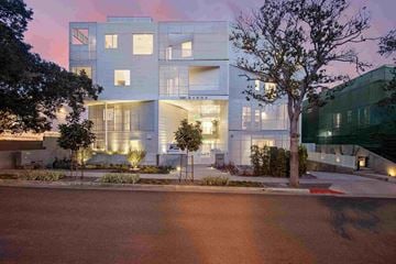 West Hollywood apartment for rent - a rendering of the exterior of a building at dusk