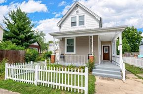 Cincinnati house for rent - a small house with a white picket fence