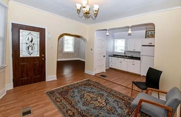 Cincinnati house for rent - a living room and a kitchen with a rug