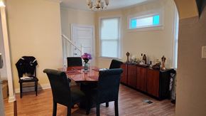 Cincinnati house for rent - a dining room with a table and chairs and a window