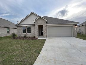 Youngsville house for rent - A house with a grey garage door and a grey roof.