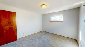 Cincinnati apartment for rent - an empty room with a red door and a window