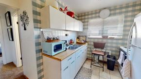 Cincinnati apartment for rent - a small kitchen with a microwave and a sink