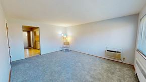 Cincinnati apartment for rent - an empty living room with white walls and carpet