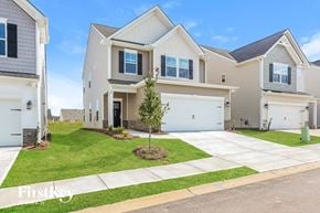 Simpsonville house for rent - A row of houses with a tree in front of the middle house.