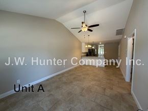 Wilson apartment for rent - A spacious room with a ceiling fan and tiled floor.