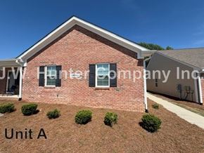 Wilson apartment for rent - A red brick house with the label "Unit A" in front of it.
