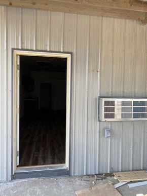 Clinton apartment for rent - an open door of a building with an air conditioning unit