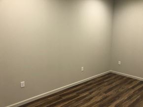 Clinton apartment for rent - a empty room with white walls and wooden floors