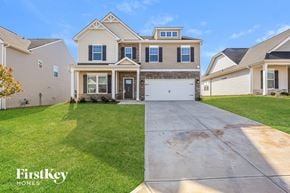 Greenville house for rent - a large house with a driveway in front of it