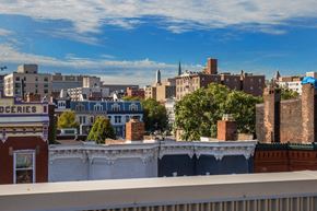 Washington apartment for rent - A cityscape with buildings of various heights and a clear sky.