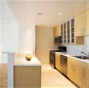 Washington apartment for rent - A kitchen with a white counter top and stainless steel appliances.