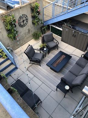 Washington apartment for rent - A patio with a couch, chair, and table.