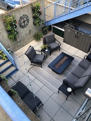 Washington apartment for rent - A patio with a couch, chair, and table.