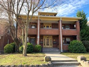 Roanoke apartment for rent - A red brick house with a white door and windows.