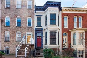 Washington apartment for rent - a row of houses on a city street with a red door