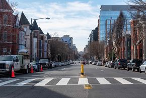 Washington apartment for rent - a city street with traffic cones and cars parked on the side of the road