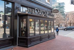 Washington apartment for rent - the facade of the capital espresso on the corner of a city street