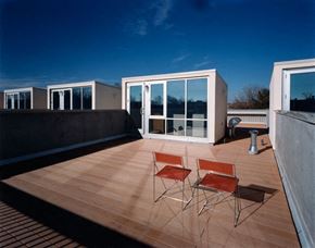 Washington apartment for rent - a roof terrace with two chairs and a glass door