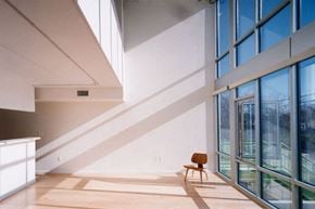 Washington apartment for rent - A room with a wooden chair and a window.