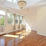 Washington apartment for rent - an empty living room with stairs and a chandelier