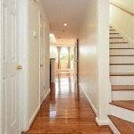 Washington apartment for rent - the hallway of a house with stairs and a wooden floor