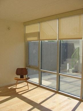 Washington apartment for rent - A chair is in front of a window with blinds.
