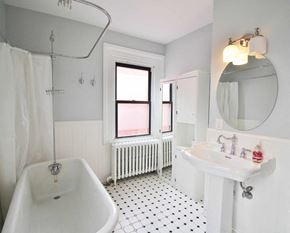Washington apartment for rent - A white bathroom with a black and white floor.
