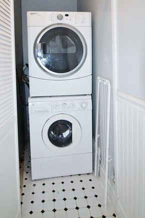 Washington apartment for rent - A white washing machine and dryer in a small laundry room.
