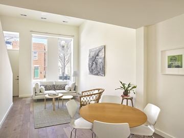 Washington apartment for rent - a living room with a table and chairs and a window