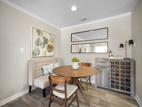 Newnan apartment for rent - A dining room with a round table and chairs.