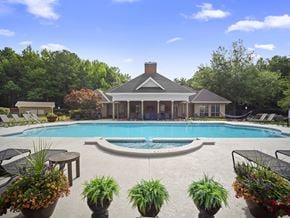 Newnan apartment for rent - A pool with a house in the background.