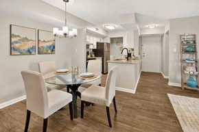 Augusta apartment for rent - A dining room with a glass table and chairs.