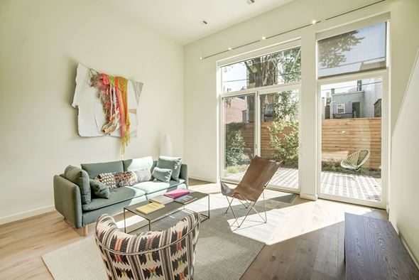 Washington apartment for rent - A living room with a grey couch, a chair and a coffee table.