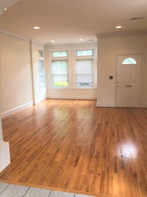 Washington apartment for rent - an empty living room with a hard wood floor