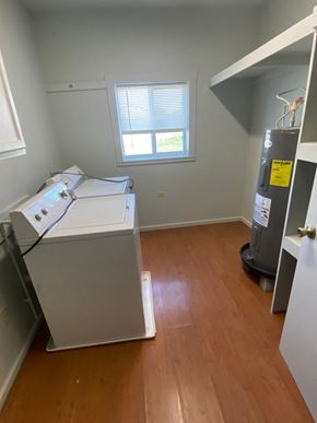 Clinton apartment for rent - a room with a dryer and a window in it