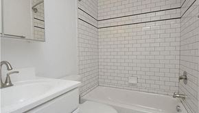 Washington apartment for rent - a white bathroom with a sink and a toilet